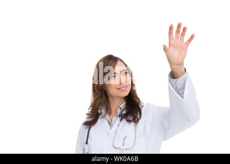Brunette doctor reaching for something in the air Stock Photo