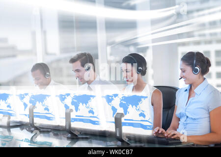 Line of call centre employees working on computers Stock Photo