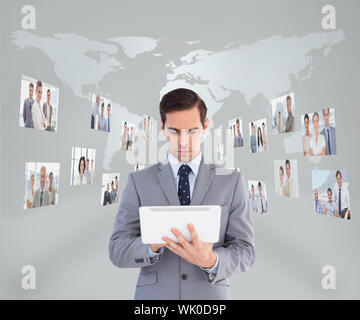Businessman using his tablet pc Stock Photo