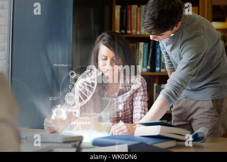 Concentrated college students analysing dna on digital interface Stock Photo