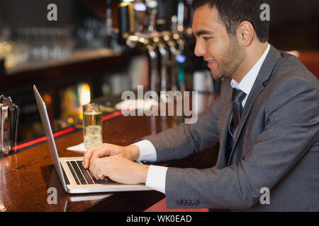 Focused businessman working on his laptop Stock Photo