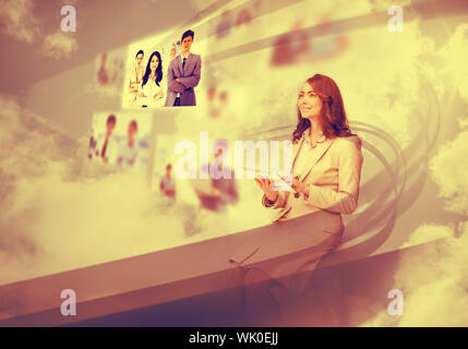 Pretty businesswoman using digital interface Stock Photo