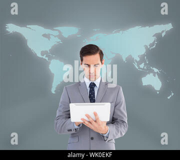 Businessman using his tablet computer Stock Photo
