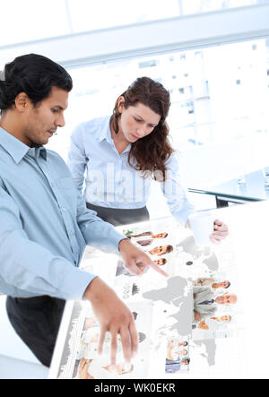 Colleagues working together on digital interface Stock Photo