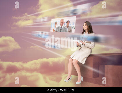 Pretty businesswoman using futuristic interface Stock Photo