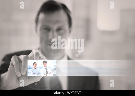 Classy businessman presenting digital interface Stock Photo