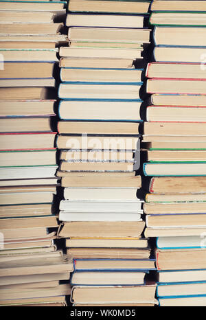 Rear view of three stacks of books Stock Photo
