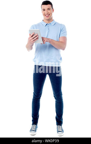 Smart guy browsing on his new tablet pc Stock Photo