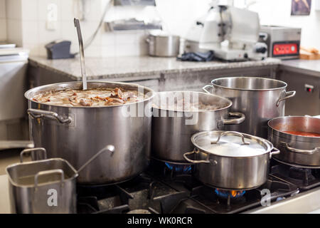 Stainless hotel pans on food warmers with various meals. Roasted meat  pieces with vegetable. Self-service buffet table. Celebration, party,  wedding Stock Photo - Alamy