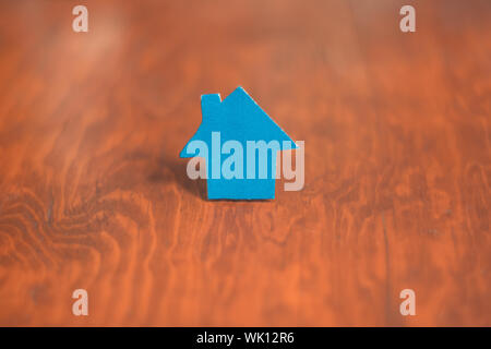 New home on wooden desk, real estate concept. Acquisition of a home. Stock Photo