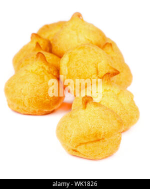 Heap of Freshly Baked Profiteroles isolated on white background Stock Photo
