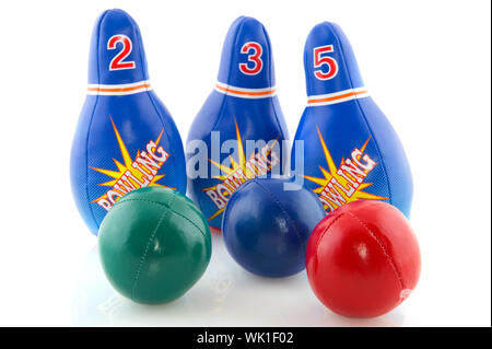 Bowling game with several pins and colorful balls Stock Photo