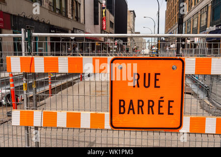 Montreal, Canada - 03 September 2019: Construction site on Sainte-Catherine street. "Rue Barrée" means closed road in french. Stock Photo