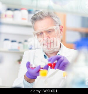 Life scientist researching in laboratory. Life sciences comprise fields of science that involve the scientific study of living organisms: microorganis Stock Photo