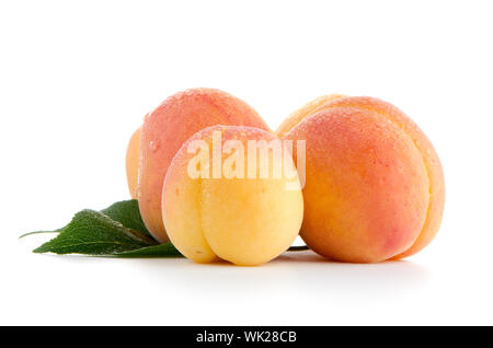 Sweet peaches with leafs on a white background Stock Photo