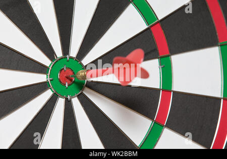 darts arrows in the target center Stock Photo