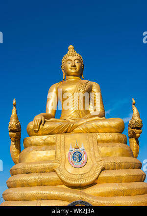 Statue Of Buddha Made Of Pure Gold Surrounded By Flowers And Offerings ...