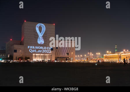 The official emblem for the Qatar 2022 FIFA World Cup has been unveiled in a synchronized projection of the logo onto some of the Qatar's most iconic buildings and in 24 other major cities across the world. The swooping curves of the emblem represent the undulations of desert dunes and the unbroken loop depicts both the number eight - highlighting the eight stadiums that will host the World Cup matches - and the infinity symbol, which reflects the interconnected nature of the event, according to tournament organizers. Stock Photo
