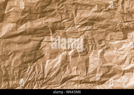 Crumpled brown kraft paper texture background. Stock Photo