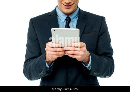 Corporate male operating touch pad device Stock Photo