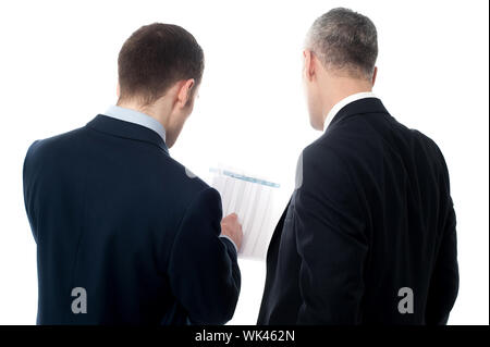 Businessmen analyzing the financial reports Stock Photo