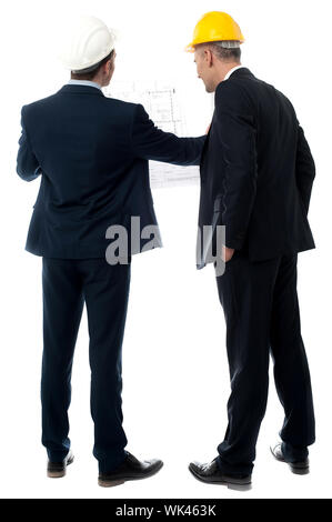 Two architects in a suit looking building plan Stock Photo