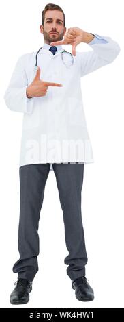 Handsome young doctor gesturing with hands on white background Stock Photo