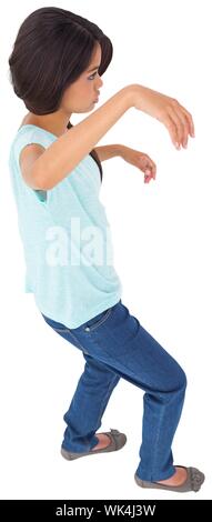 Powerless brunette in jeans and tshirt on white background Stock Photo
