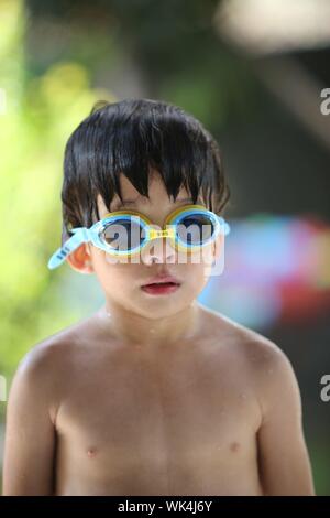 Little Boy Wearing Swimming Goggle At Poolside Stock Image 