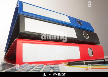 Stack of three business binders low angle view Stock Photo