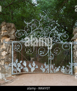 Iron gate leading to the Hartman Prehistoric Garden within Zilker Botanical Gardens in Austin, Texas Stock Photo