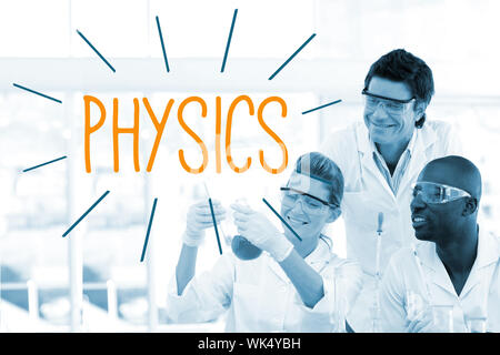 The word physics against scientists working in laboratory Stock Photo