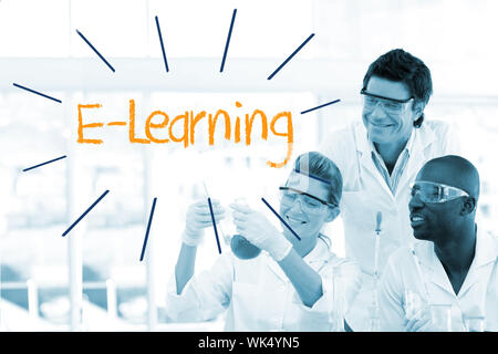 The word e-learning against scientists working in laboratory Stock Photo