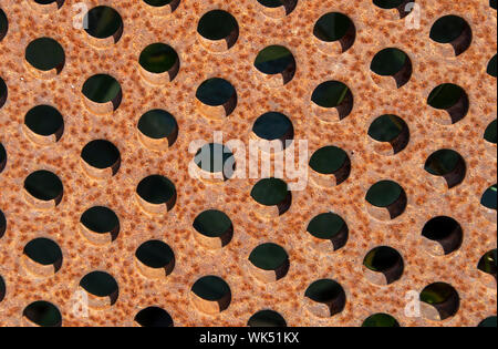 rusty metal plates with holes Stock Photo
