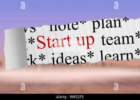 The word start up against cityscape on the horizon Stock Photo
