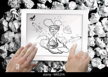 Composite image of hand touching tablet showing hourglass doodle Stock Photo