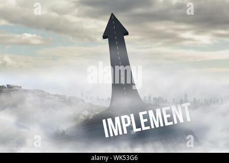 The word implement against road turning into arrow Stock Photo