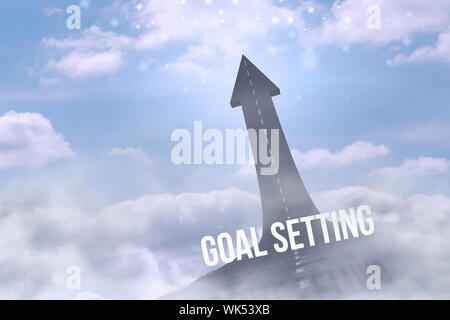 The word goal setting against road turning into arrow Stock Photo
