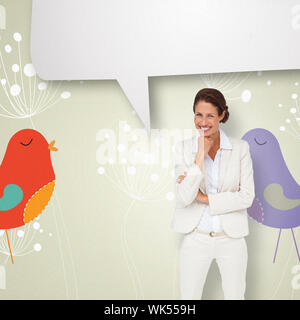 Thinking businesswoman with speech bubble against feminine design of dandelions and birds Stock Photo