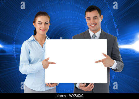 Business partners showing card against futuristic shiny design with code Stock Photo