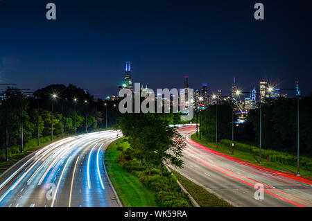 Lights in the city at night. Skyline and traffic on the streets of Chicago, Illinois. Stock Photo