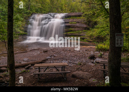 Landscape View of the Main Cascade of Pixley Falls with Seat Bench in Foreground Stock Photo