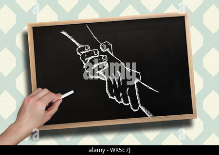 Composite image of hand drawing handshake with chalk on chalkboard with wooden frame Stock Photo