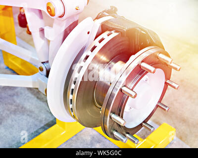 Independent front suspension and brake disc for bus on exhibition Stock Photo