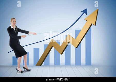 Businesswoman pulling a rope around arrow against blue bar chart with blue arrow Stock Photo