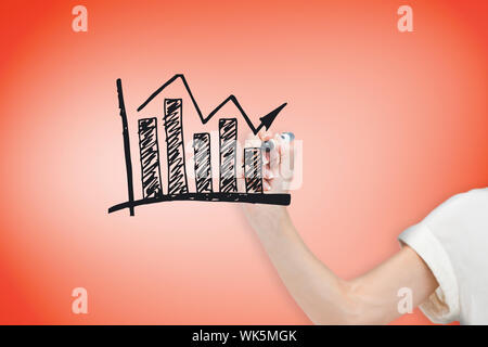 Composite image of businesswoman drawing graph against orange Stock Photo