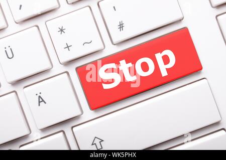 stop key on keyboard in red showing halt concept Stock Photo