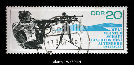 Stamp issued in Germany - Democratic Republic (DDR) dedicated to biathlon world championship in Altenberg, circa 1967. Stock Photo