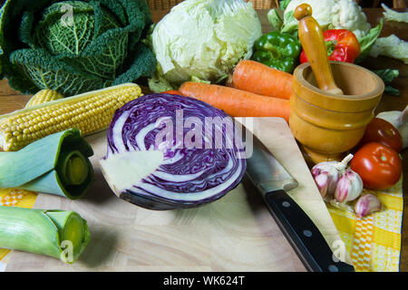 Still life with assortment vegetables on wooden table Stock Photo