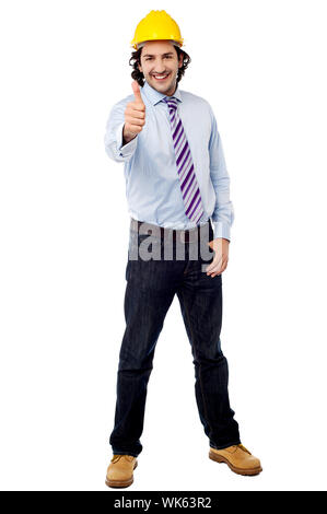 Smiling engineer in hardhat and thumbs up Stock Photo